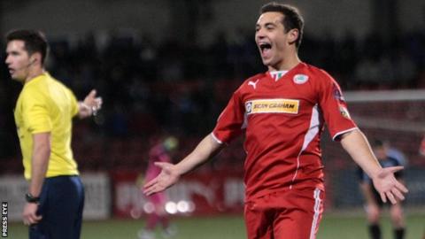 Substitute David McDaid hit Cliftonville's winner against Ballymena