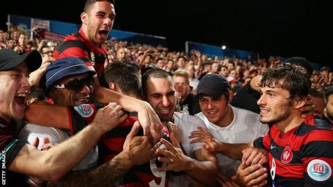 West Sydney Wanderers players celebrate with fans