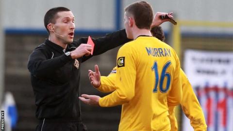 Mervyn Smyth hands out a red card in 2011