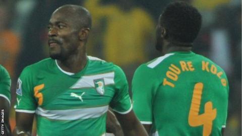 Ivory Coast's Didier Zokora and Kolo Toure