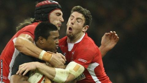 Luke Charteris and Alex Cuthbert tackle New Zealand's Julian Savea in November, 2012