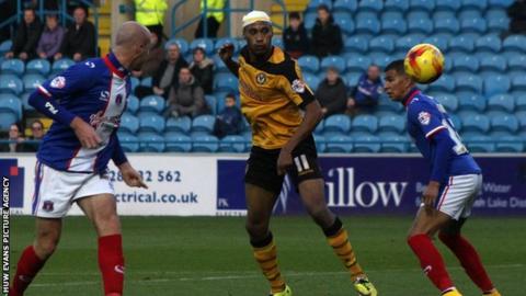 Newport County's Chris Zebroski heads towards goal