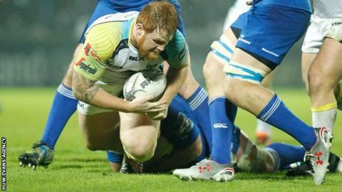 Dan Baker is tackled in Dublin