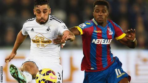 Neil Taylor in action against Crystal Palace.
