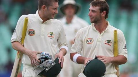 Michael Clarke (left) with Phillip Hughes