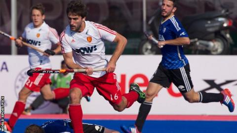 England's Adam Dixon lines up a chance against Argentina at the 2014 Champions Trophy