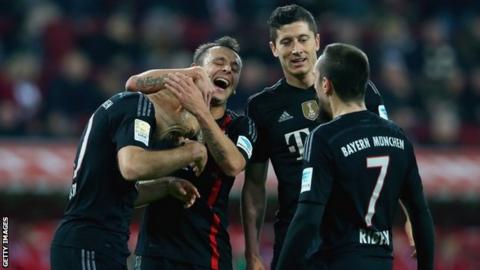 Bayern Munich players celebrate one of their four goals in the 4-0 win over Augsburg