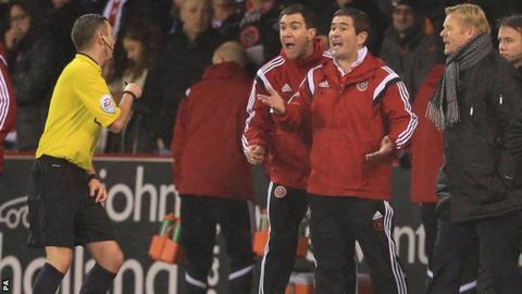 Referee Michael Oliver, Sheffield United boss Nigel Clough and Saints counterpart Ronald Koeman (right)