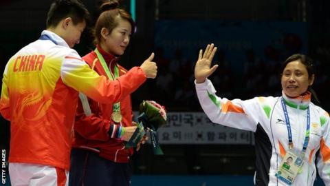 Laishram Sarita Devi (right)