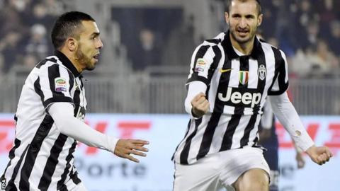 Carlos Tevez (left) celebrates scoring for Juventus