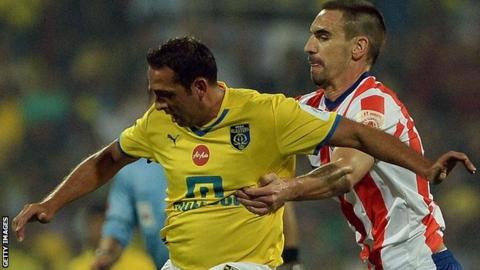 Kerala Blasters striker Michael Chopra (left) and Atletico Kolkata's Borja Fernandez