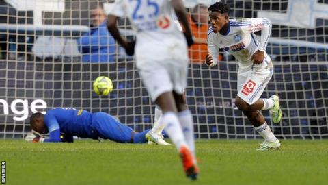 Marseille forward Michy Batshuayi (right) wheels away to celebrate his side's winner against Lille