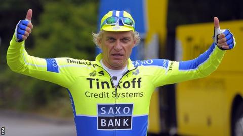 Saxo-Tinkoff procycling team's owner Russian Oleg Tinkov gives thumbs up after a practice session in Bradford.