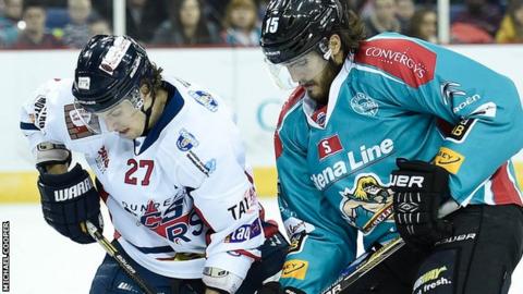 Kevin Westgarth of the Belfast Giants in action against Kevin Quick of the Dundee Stars