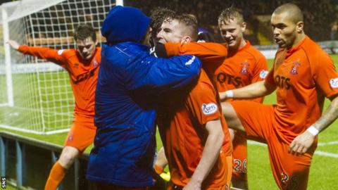 Craig Slater is surrounded by celebrating Kilmarnock team-mates