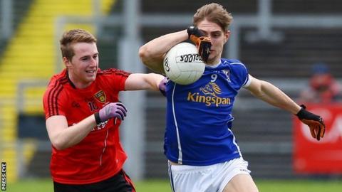 Paul Devine and Killian Clarke contend for possession as Cavan beat Down at Pairc Esler