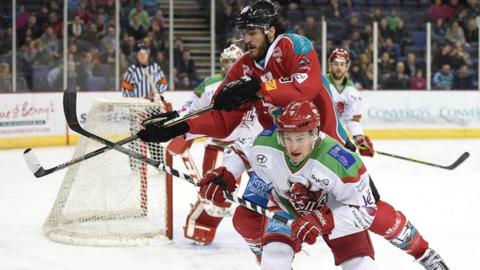 Belfast's Kevin Westgarth makes a high challenge on Devils opponent Mark Richardson