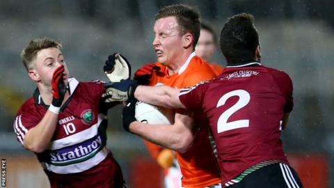 Armagh's Declan McKenna is challenged by St Mary's pair Jerome Johnston and Ruairi Wilson