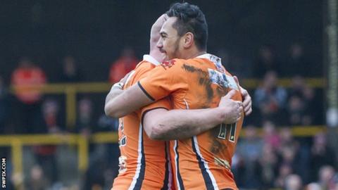 Denny Solomona and Liam Finn celebrate a Castleford try