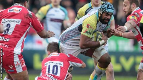 Tevita Cavubati of Ospreys is tackled by Billy Burns of Gloucester