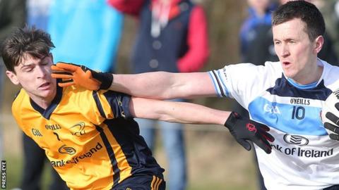 DCU's Sean McGabhainn competes with Cillian O'Connor of UUJ