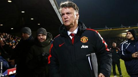 Manchester United manager Louis van Gaal takes his seat at the Abbey Stadium