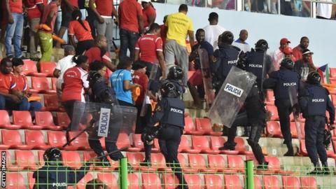 Police try to gain control of fans at the match between Ghana and Equatorial Guinea