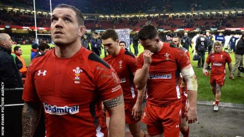 Paul James and team-mates leave the Millennium Stadium pitch after defeat to England