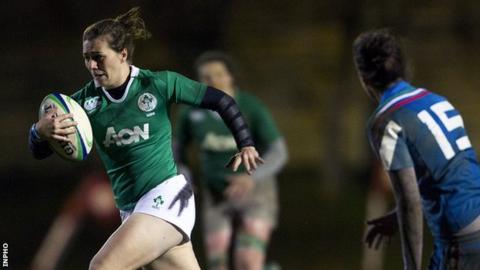 Katie Fitzhenry bursts away from Italian full-back Manuela Furlan in last Friday's game in Florence
