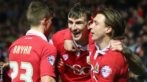 Aden Flint celebrates scoring for Bristol City
