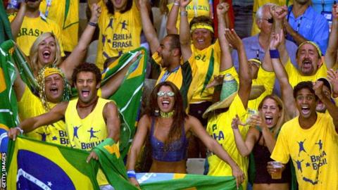 Brazil fans cheer on their team