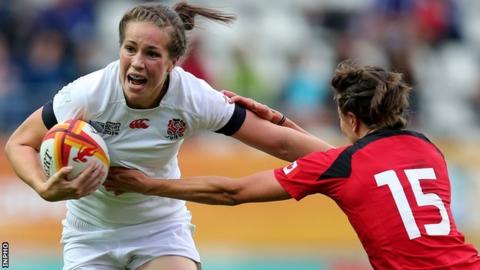England's Emily Scarratt is tackled by Julianne Zussman of Canada