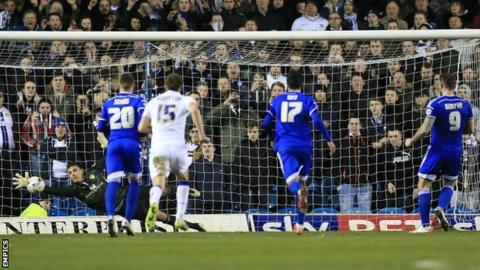 Leeds goalkeeper Marco Silvestri saves a late penalty from Daryl Murphy