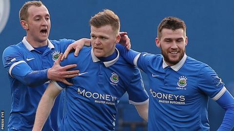 Linfield celebrate Ross Clarke's opening goal against Warrenpoint