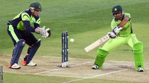 Gary Wilson looks on as Pakistan's Sarfaraz Ahmed strikes the ball in Adelaide