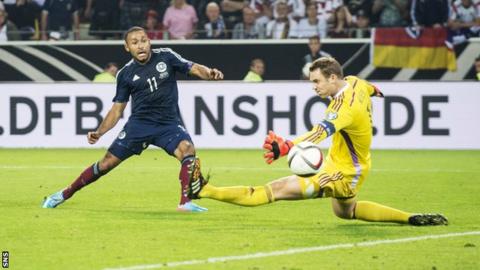 Ikechi Anya scores for Scotland against Germany in September