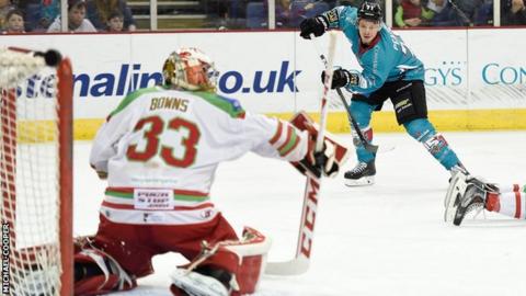 Devils netminder Ben Bowns awaits a shot from Belfast's Craig Peacock