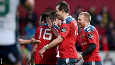 Munster players congratulate Keith Earls, scorer of his side's sixth try