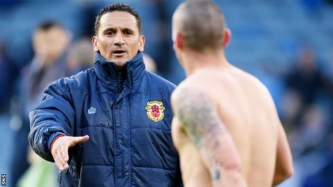 Gibraltar interim head coach David Wilson congratulates Scotland captain Scott Brown