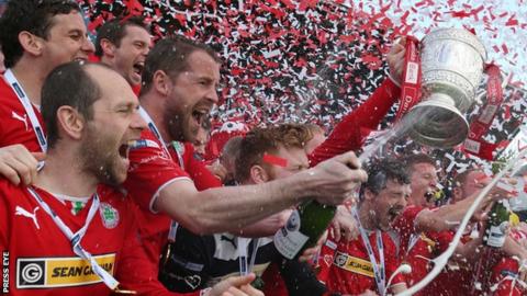 Cliftonville players celebrate winning the Irish Premiership title last year