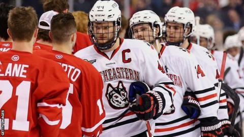 Northeastern University players shake hands with Northeastern University opponents