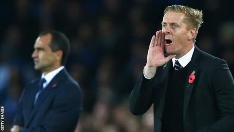 Roberto Martinez (L) and Garry Monk (R)