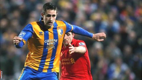 Chris Clements in action for Mansfield against Liverpool in the FA Cup in 2013