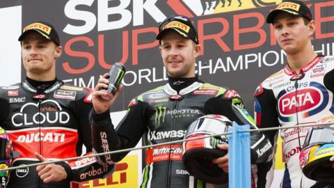Chaz Davies, Jonathan Rea and Michael van der Mark celebrate on the podium