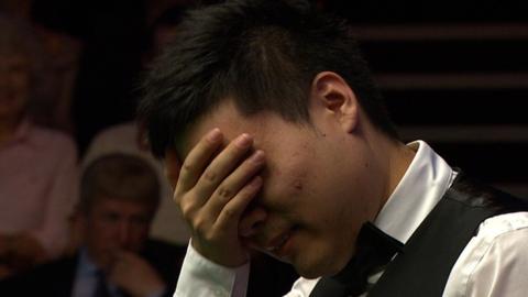 China's Ding Junhui makes a mess of a chance of 147 maximum break at the World Snooker Championships in Sheffield