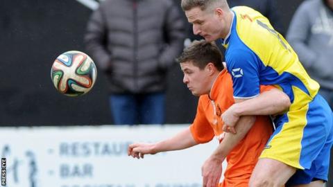 Carrick's Ben Roy is challenged by Bangor opponent Thomas Wray