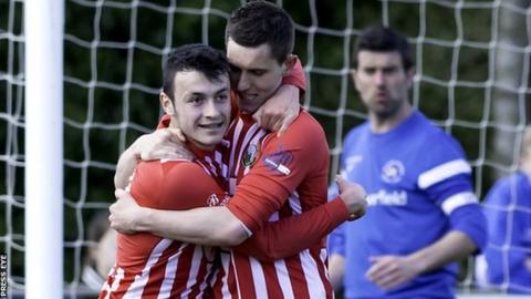 Daniel Hughes is congratulated after scoring a penalty