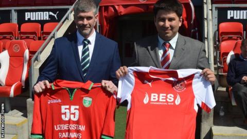Fleetwood’s CEO Steve Curwood and Lokomotiv Tashkent's Davron Azizov