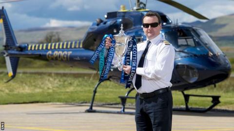 Helicopter pilot David Blane delivered the Scottish League One trophy to Morton at Cappielow