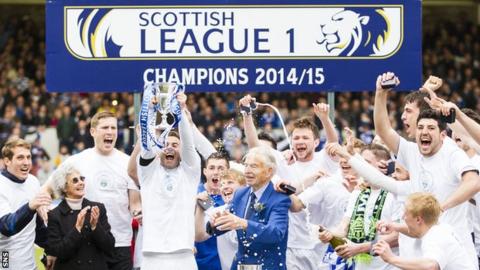 Greenock Morton players celebrate with the Scottish League One trophy